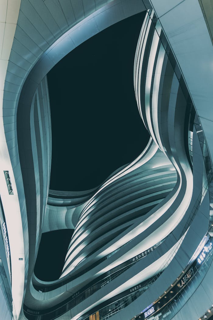 why-choose-us-02 Low angle view of modern Milky Way Soho in Beijing at dusk. Futuristic curves and lines in dramatic urban setting.